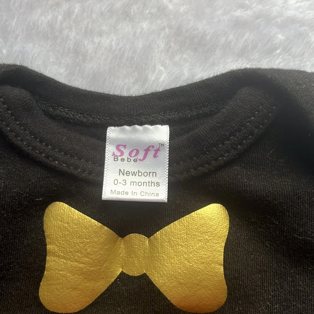 Black baby gown with gold heart and‎ bow detail
